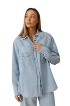 Women's denim shirt with chest pockets and snaps