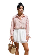 Women's polka dot shirt with a tied cuff