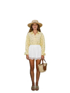 Women's polka dot shirt with a tied cuff
