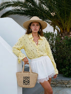 Women's polka dot shirt with a tied cuff