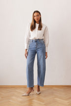 Women's shirt with a stand collar and pleats at the front