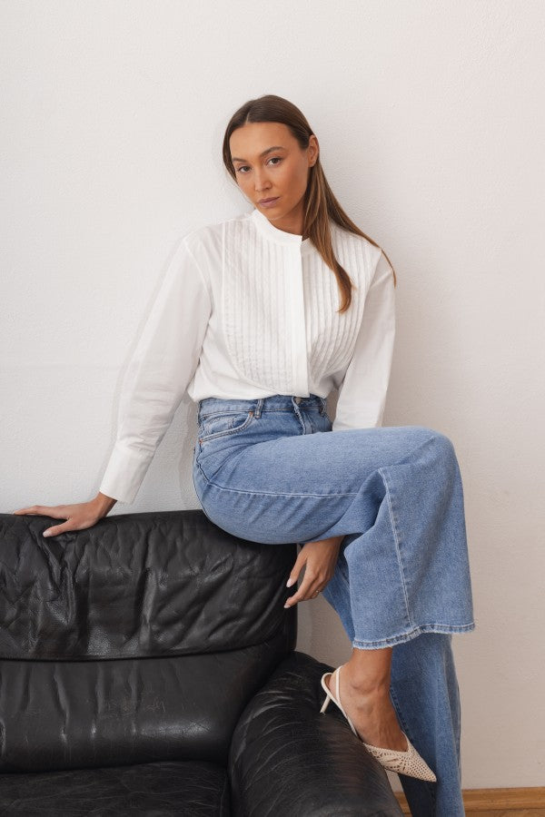 Women's shirt with a stand collar and pleats at the front