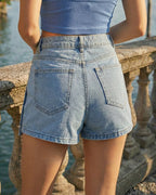 Women's denim skirt-shorts with an asymmetrical overlay