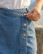Women's denim skirt-shorts with a pleat and three silver snaps