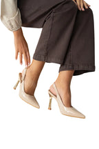 Women's patent stiletto heels with open heel, pointed toe, and gold heel