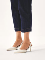 Women's high heels with an open heel, pointed toe, and side cutout