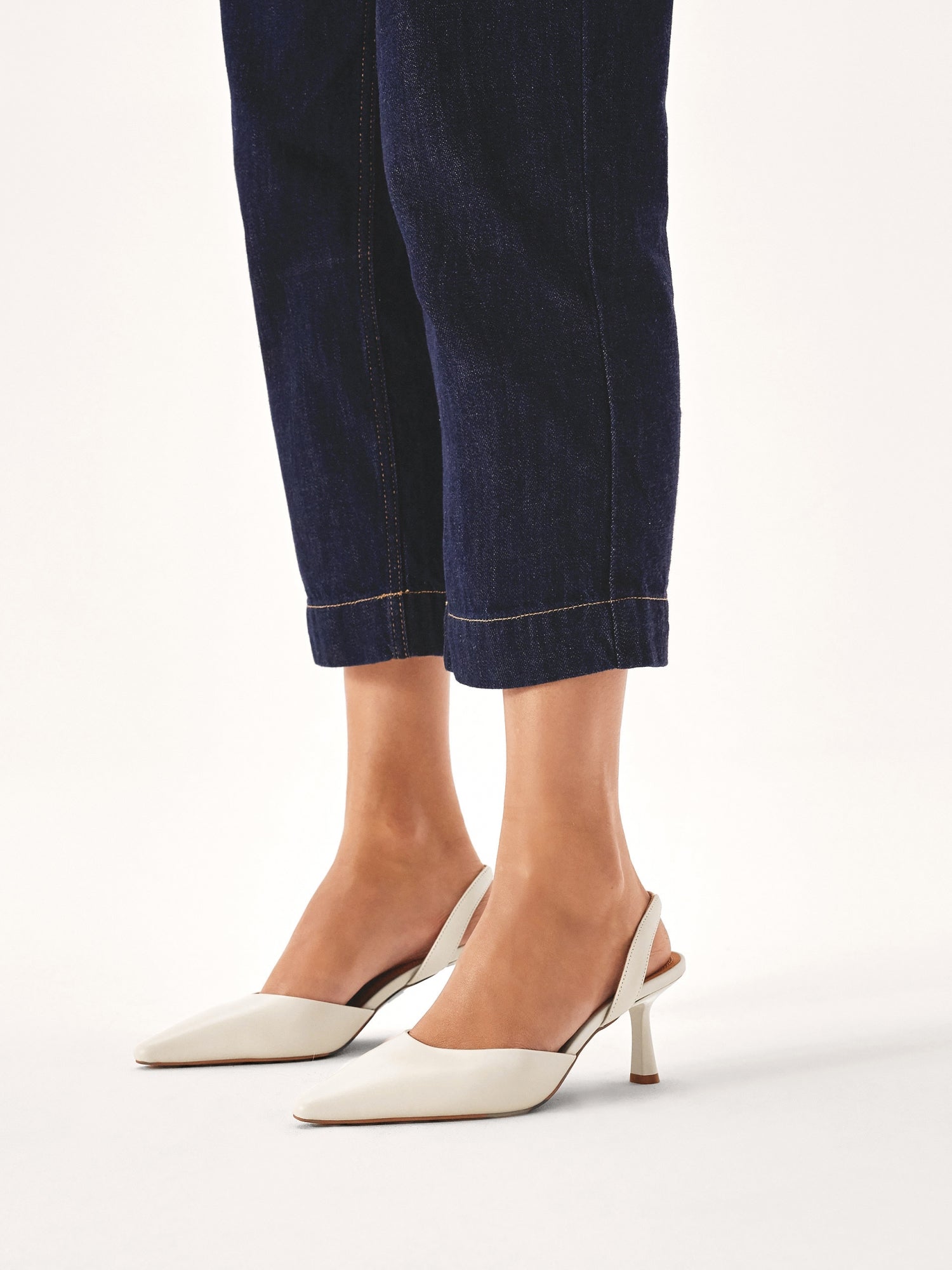 Women's high heels with an open heel, pointed toe, and side cutout
