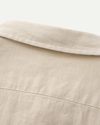 Men's shirt made of textured fabric with a chest pocket and long sleeves