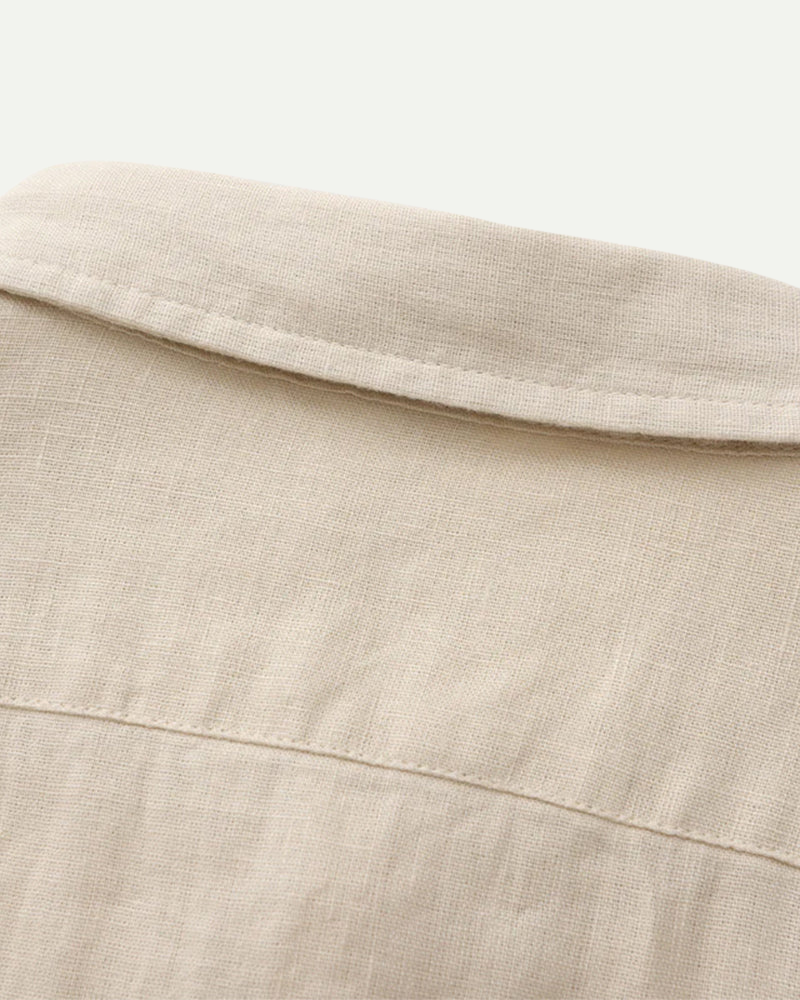 Men's shirt made of textured fabric with a chest pocket and long sleeves