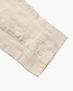 Men's shirt made of textured fabric with a chest pocket and long sleeves