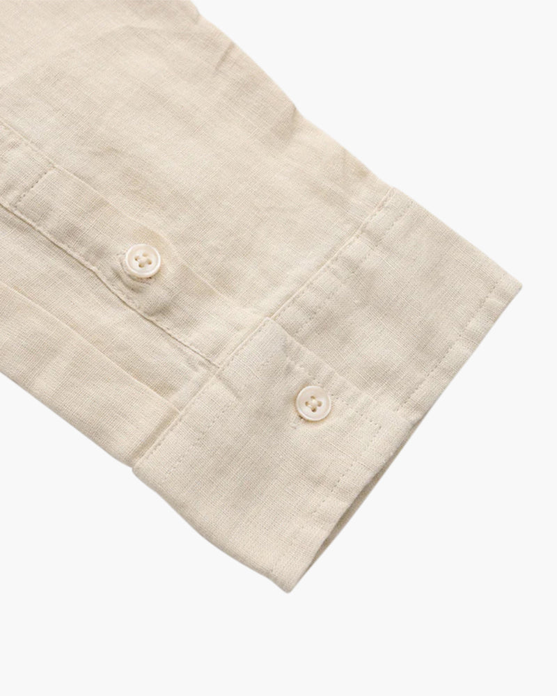Men's shirt made of textured fabric with a chest pocket and long sleeves