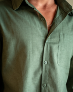 Men's shirt made of textured fabric with a chest pocket and long sleeves