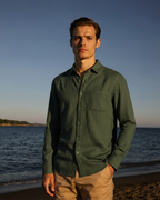 Men's shirt made of textured fabric with a chest pocket and long sleeves