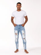 Męskie jeansy skinny z przetarciami – widok z przodu