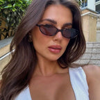 Women's sunglasses with a narrow frame and tinted lenses