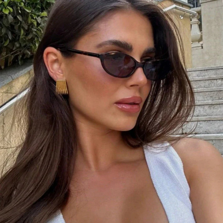 Women's sunglasses with a narrow frame and tinted lenses