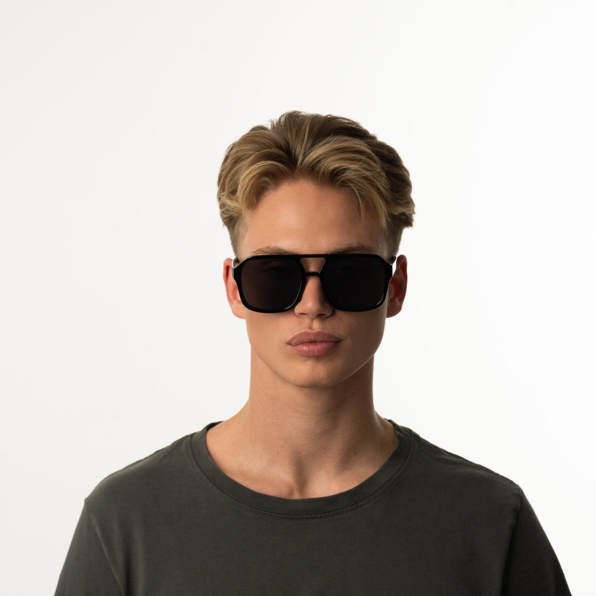 Unisex aviator sunglasses with wide black lenses