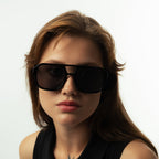 Unisex aviator sunglasses with wide black lenses