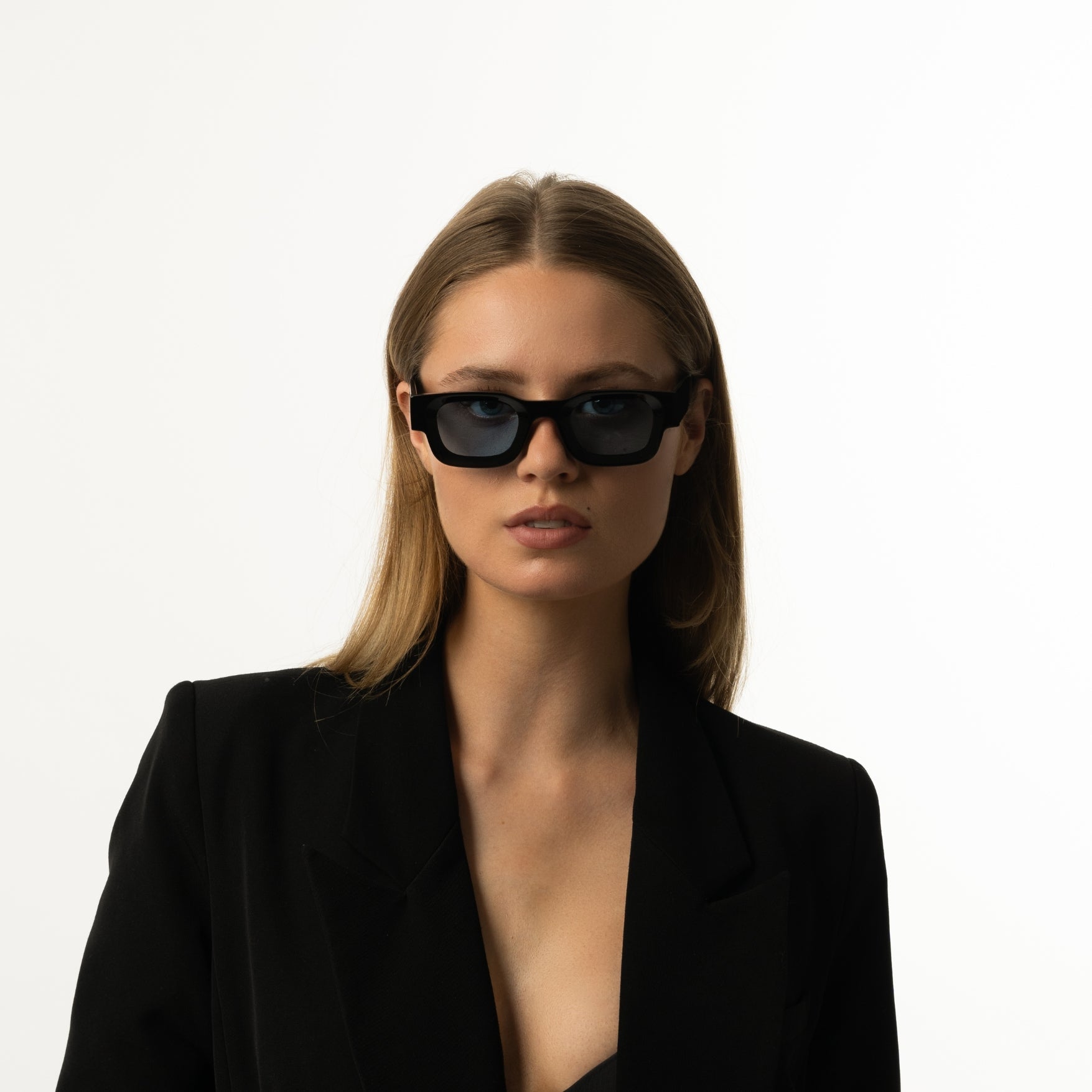 Unisex sunglasses with a rectangular frame and blue lenses