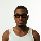 Unisex sunglasses with a rectangular frame and yellow lenses