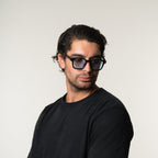 Unisex sunglasses with a wide flat frame and blue lenses
